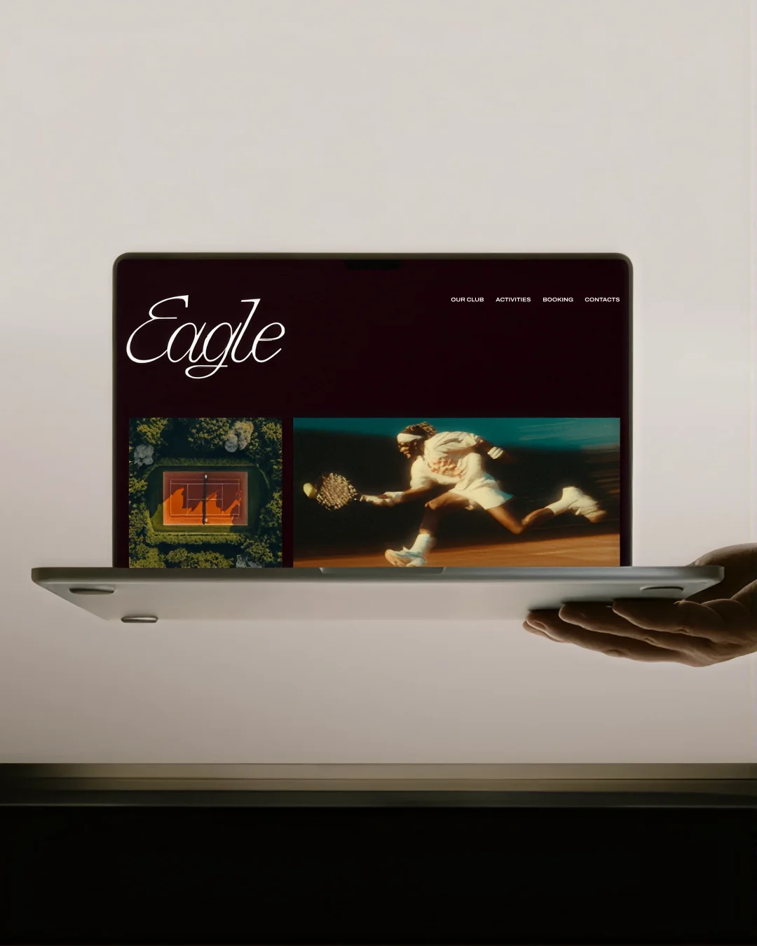 Eagle tennis club website displayed on a laptop.