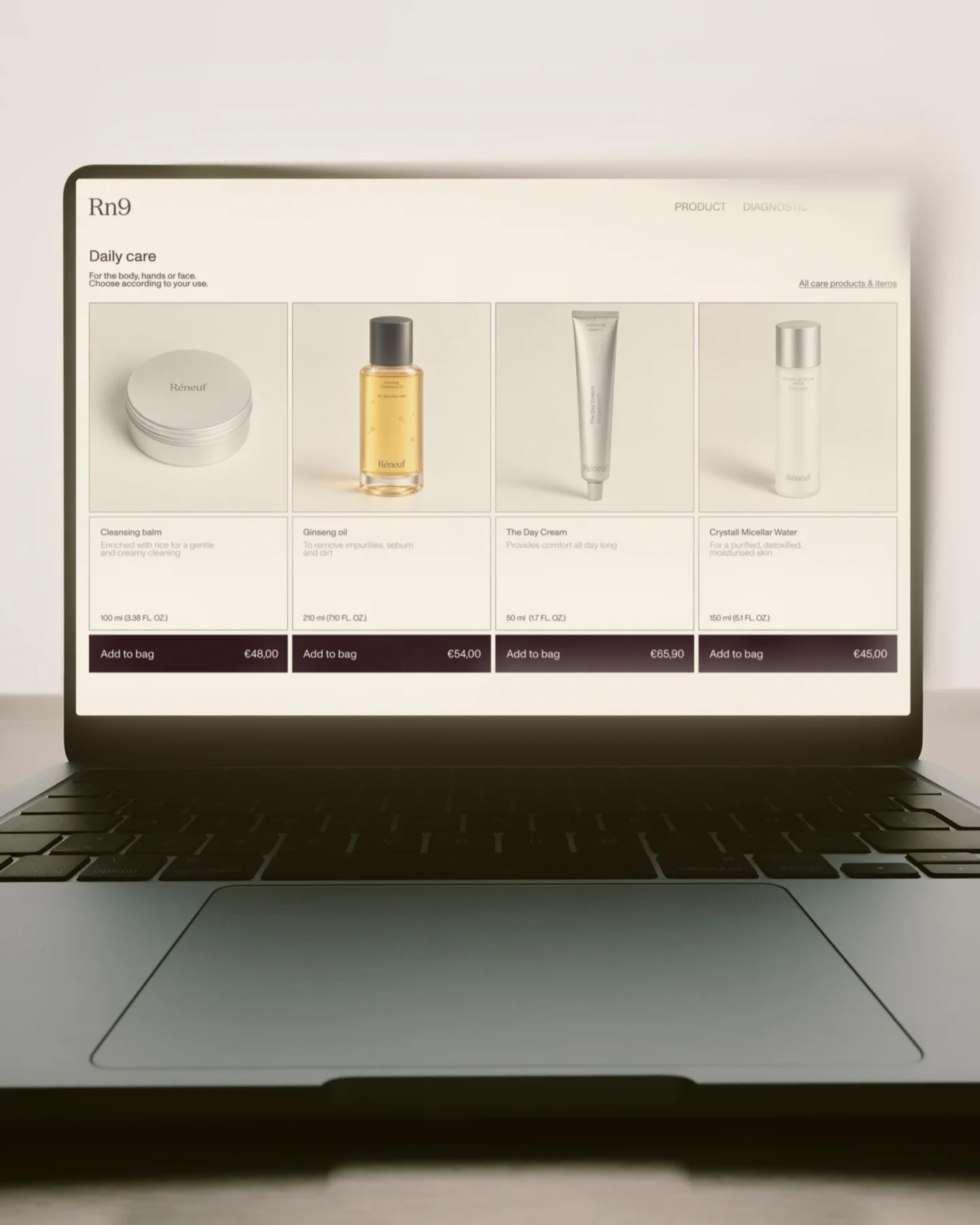 Réneuf skincare shop displayed on a laptop.